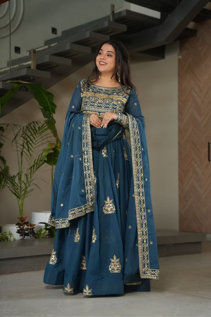 gown made of turquoise blue chinnon fabric with an embroidered dupatta