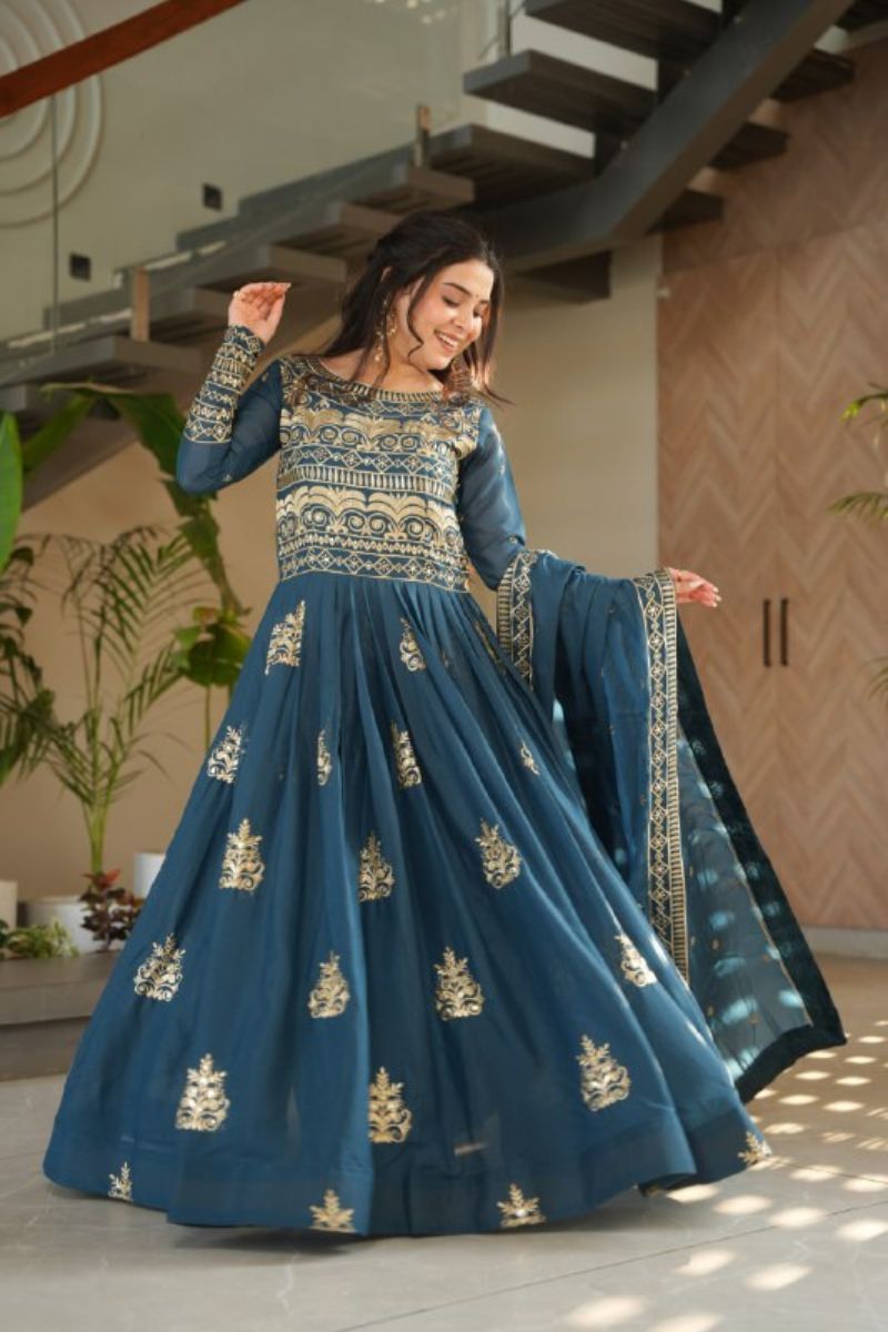 gown made of turquoise blue chinnon fabric with an embroidered dupatta