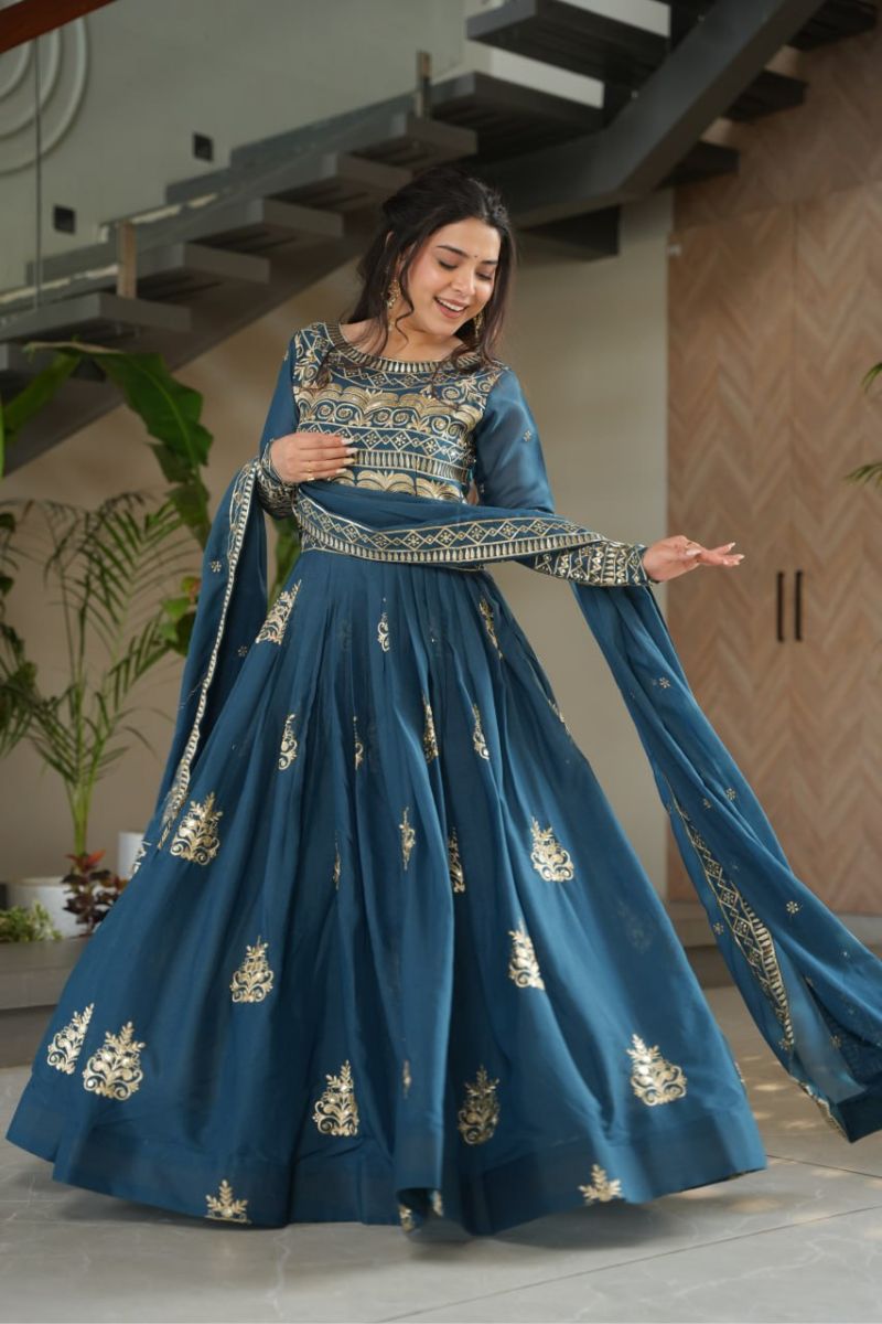 gown made of turquoise blue chinnon fabric with an embroidered dupatta