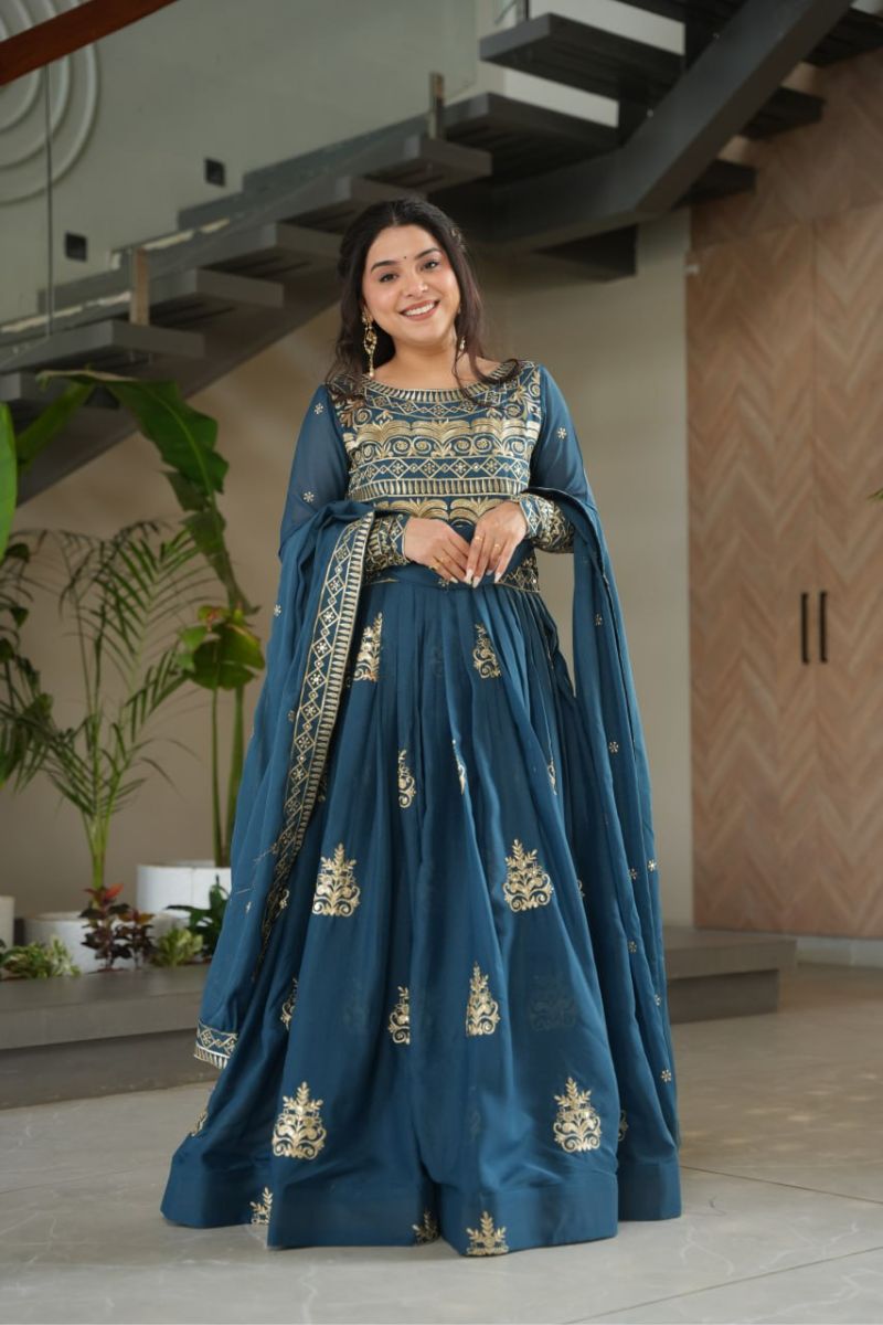 gown made of turquoise blue chinnon fabric with an embroidered dupatta