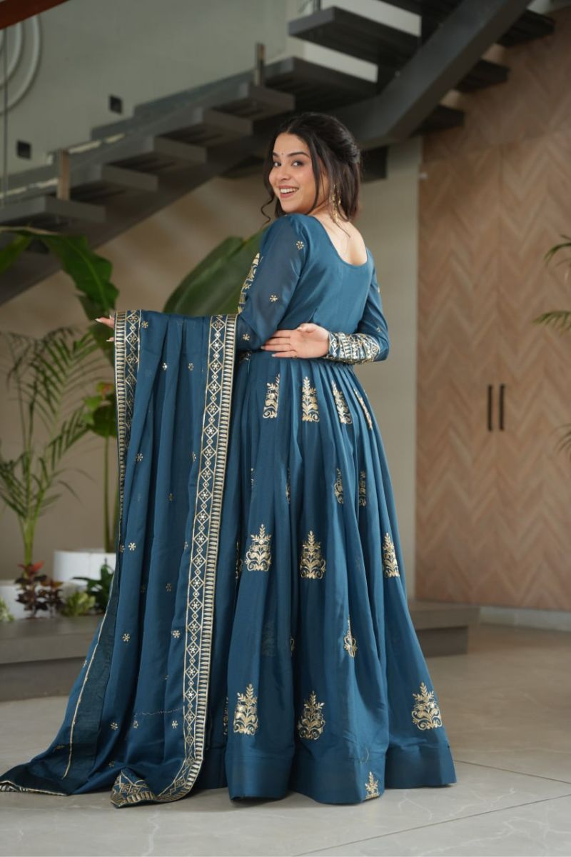 gown made of turquoise blue chinnon fabric with an embroidered dupatta